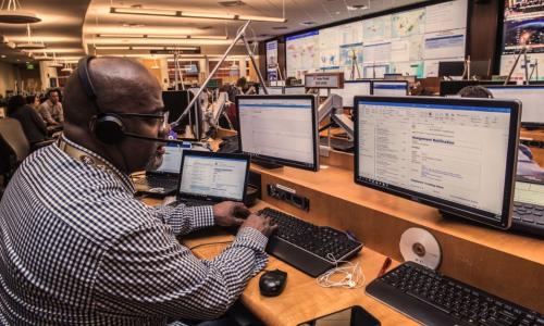 Man monitoring computers at CDC Emergency Operations Center during coronavirus response