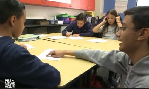 Student helping a teacher