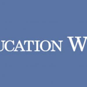 Periwinkle blue Education Week logo.