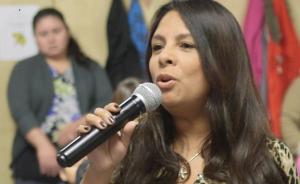 woman speaking in to microphone