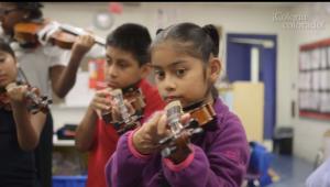 Young girl playing a violin