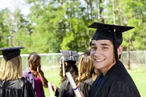 a young man in a cap and gown