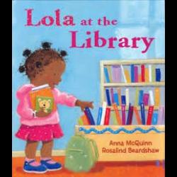 Young girl in front of bookshelf