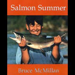 Boy holding up a salmon