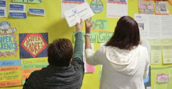 Families posting on a bulletin board