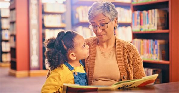 Girl and grandmother at library